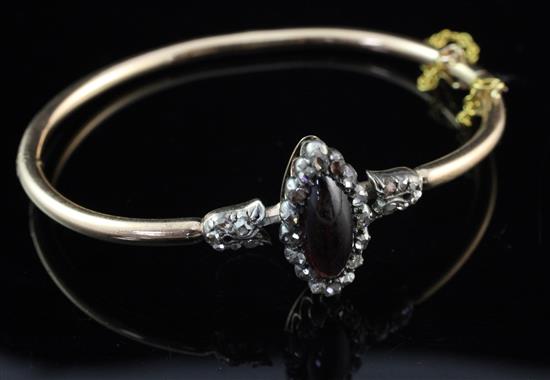 A Victorian gold, garnet and diamond hinged bangle,